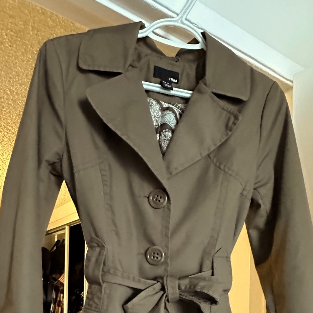 Stylish tan/brown Trench coat. Gently worn. Love it, but doesn’t fit anymore.